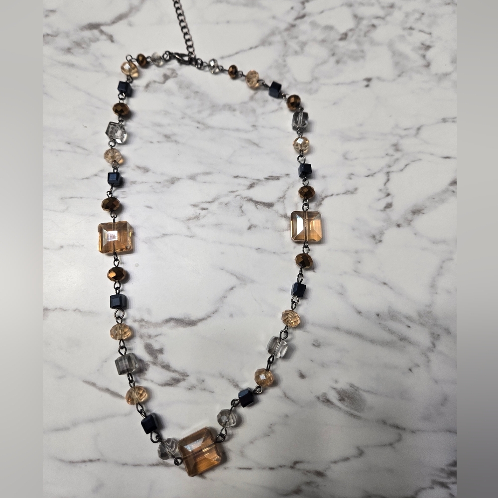 Elegant Beaded Necklace with Gold and Black Accents